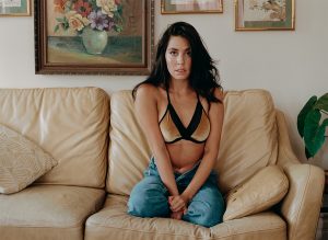 35mm film photo of girl in bikini on couch
