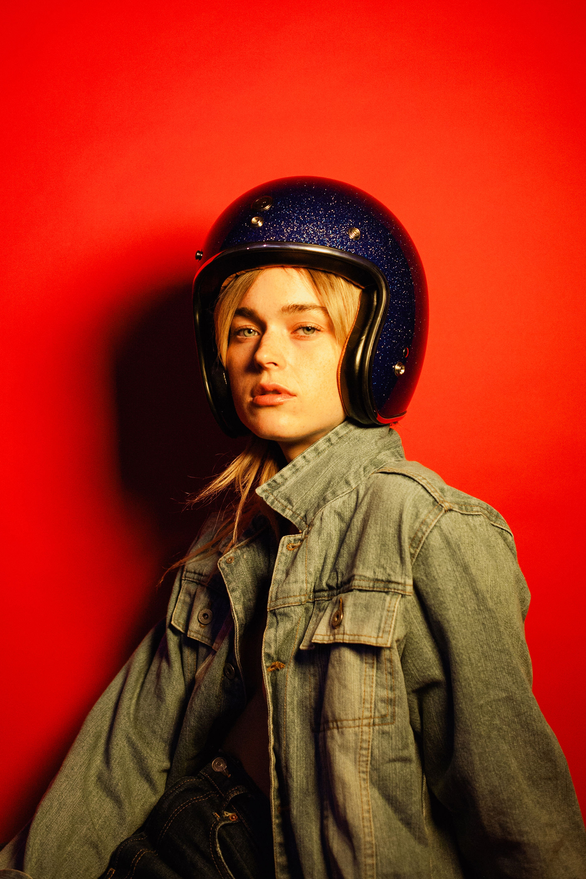 woman with helmet on red background